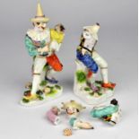 NOTE THE FIGURE WITH VIOLIN BOW IS BROKEN Pair of Vienna porcelain figures in harlequin costumes