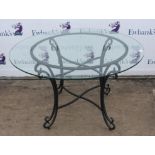 Circular glass and wrought metal centre table, 74x117cms