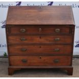 A 19th Century mahogany fall front bureau, fall over four long graduated drawers raised on bracket
