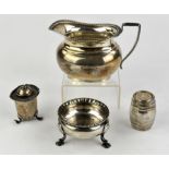 Silver cream jug, barrel shaker, George III cauldron salt, London 1759, and a pepperette,