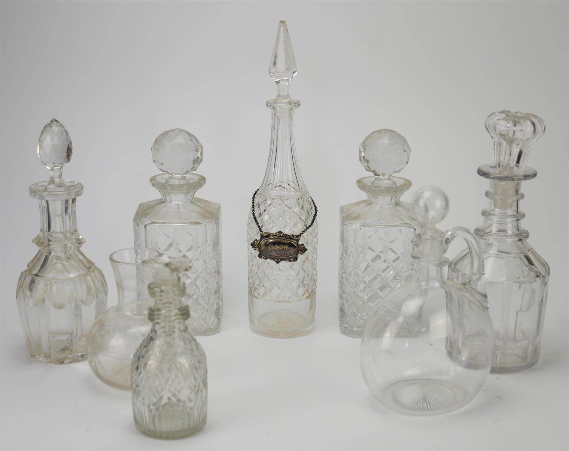 Quantity of drink decanters in differing designs.