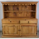 Large pine dresser, with a row of pot hooks, above a single shelf, the base with frieze drawers