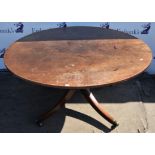 Circular tilt top table.