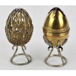 Two modern silver and gilt limited edition Easter Eggs, with wire work stands, hallmarked by St