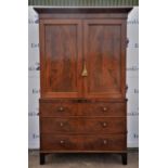 19th century mahogany linen press, upper section enclosing four shelves over two short and two long