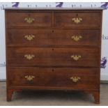 An oak chest, 19th Century, with two short and three long drawers, on bracket feet,