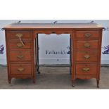 Victorian walnut Aesthetic Movement pedestal desk, the top inset with brown leather writing surface,