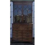 George lll mahogany secretaire bookcase, the upper section with glazed doors enclosing two shelves,