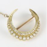 A pearl and diamond crescent brooch, set with a row of single cut diamonds, and a row of pearls,