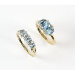 Blue topaz and diamond dress ring, set with three oval cut blue topaz and four round brilliant cut