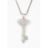 Diamond key pendant, measuring 5cm with bale, pave set with round brilliant diamonds in 18 ct white