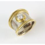 Elizabeth Gage, diamond tapered Templar ring, set with a round brilliant cut diamond weighing an