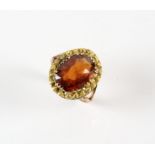 Hessonite garnet dress ring, oval mixed cut hessonite garnet weighing an estimated 5.70 carats,