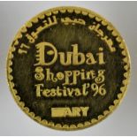 A Dubai fine gold coin commemorating the inaugural Dubai World Cup horse race and shopping festival,