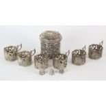 Embossed silver dressing table pot, six coffee can holders, four silver thimbles, total weight 9.