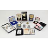 A collection of both silver proof and circulated coins and other items. including a privately made