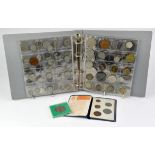 An album of mixed coins, medallions and tokens, including a sixpence commercial silver token