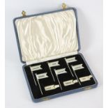 Cased set of six silver sandwich markers with twenty named ivorine labels and two blank labels,
