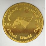 A Dubai fine gold coin commemorating the inaugural Dubai World Cup horse race and shopping festival,