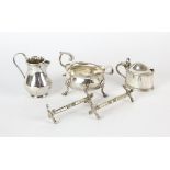 George III silver cream jug with flared rim and scroll handle, London 1783, marks rubbed,