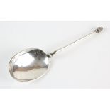 White metal anointing spoon the tapering handle with pineapple terminal and hammered bowl,
