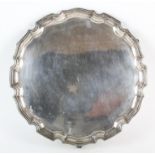 Modern silver salver with pie crust border on scroll feet by Israel Freeman & Son Ltd, London 1961,