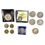 A £2, 1 ounce silver British Britannia coin 1998 in a capsule, together with four £5 coins 1999,