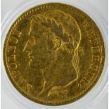 A France 1808 20 franc gold coin in a capsule, about good fine.