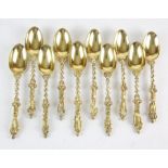 Ten Victorian silver-gilt apostle spoons each with cast cherub and serpent stems and terminating