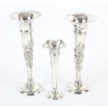 Pair of embossed silver trumpet vases, Birmingham 1906 and another single vase (3)