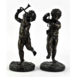 Pair of patinated bronze figures of putti one with a triangle the other with a horn, H 24cm