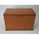 Edwardian oak stationary cabinet, with two brass carrying handles, opening to reveal an arrangement