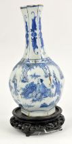 A late Ming blue and white vase of hexagonal bottle form, decorated with a narrative scene of