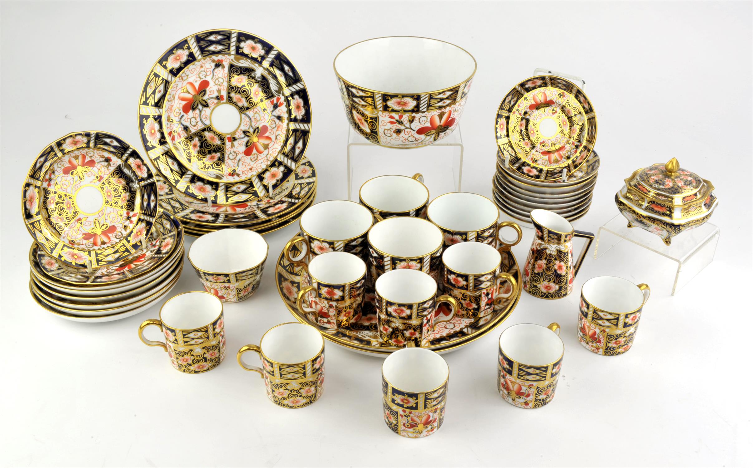 Royal Crown Derby Imari porcelain, a quantity to comprise ten saucers, eight cans, a bowl,