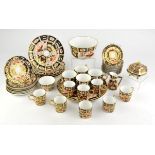 Royal Crown Derby Imari porcelain, a quantity to comprise ten saucers, eight cans, a bowl,