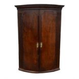 Oak & mahogany banded corner cupboard, 18th/19th Century, the single door flanked by reeded