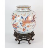 A Chinese Imari oviform vase and cover, decorated with a bold underglaze blue kylin; 23 cm high,