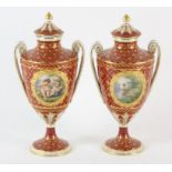 A pair of French porcelain urns, 20th Century, decorated with vignettes of garden landscapes,