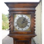 Walnut Grandmother clock. 20th Century, the silver dial with Roman and Arabic numeral chapter ring,