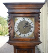 Walnut Grandmother clock. 20th Century, the silver dial with Roman and Arabic numeral chapter ring,