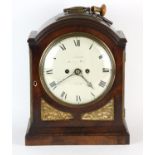 William IV mahogany mantle clock, with arched top and pierced brass sound boards, on a plinth base,