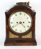 William IV mahogany mantle clock, with arched top and pierced brass sound boards, on a plinth base,