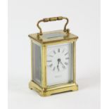 French brass carriage clock, the white enamel dial with Roman numeral chapter ring,