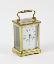 French brass carriage clock, the white enamel dial with Roman numeral chapter ring,