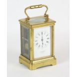 French brass cased carriage clock, retailed by J W Benson, late 19th Century, the white enamel dial