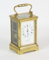 French brass cased carriage clock, retailed by J W Benson, late 19th Century, the white enamel dial