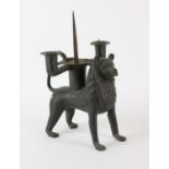 A bronze aquamanile, in the form of a lion, late 19th Century or later, converted to a pricket