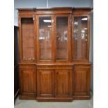 Victorian walnut breakfront bookcase, the central section with glazed doors enclosing shelves above