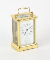 French brass carriage clock, with white enamel dial with Roman and Arabic numeral chapter ring,