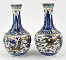A pair of polychrome vases decorated with dragons, 26 cm high, with four-character marks for Kangxi,
